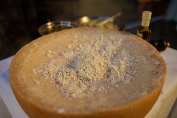 parmesan cheese wheel with shreds